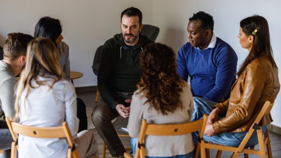 What Happens After IOP a group of people meet in a support group after IOP.