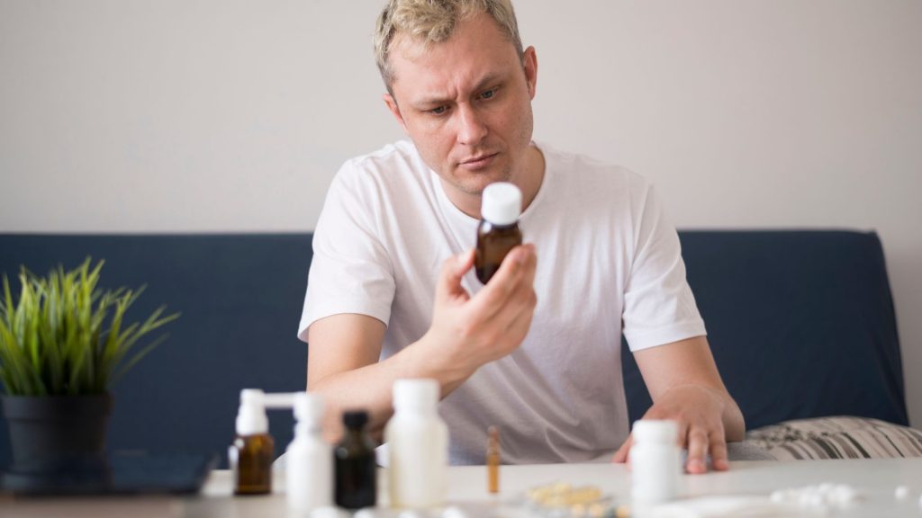 Man examining benzodiazepine medicine
