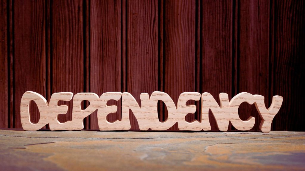 Wooden letters spelling dependence, representing benzodiazepine dependence risk