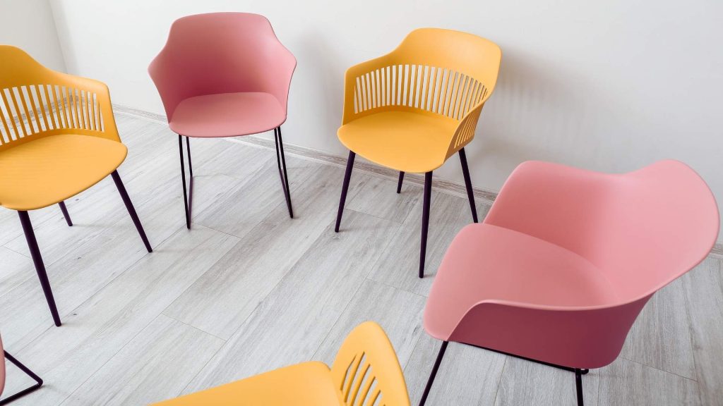 Chairs arranged in a circle for group therapy in addiction treatment programs.