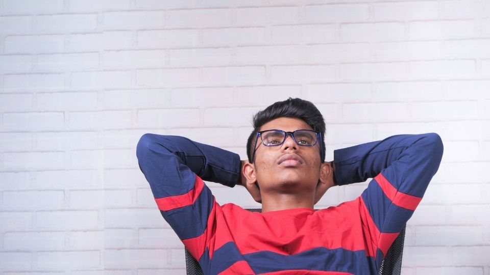 a man thinks about the definition of greening out, which comes from overconsuming THC.