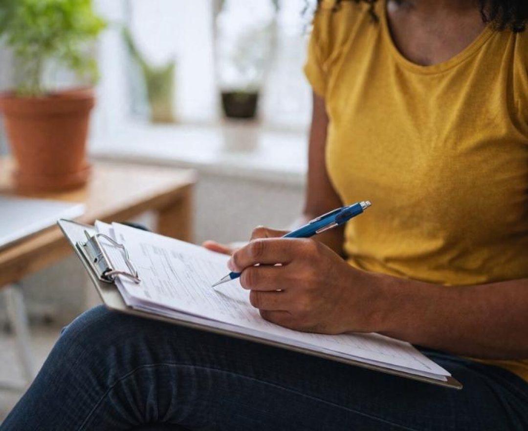 Doctor writes notes from drug assessment